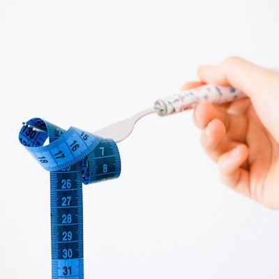 Close-up of a person's hands gripping a weight, symbolizing control.