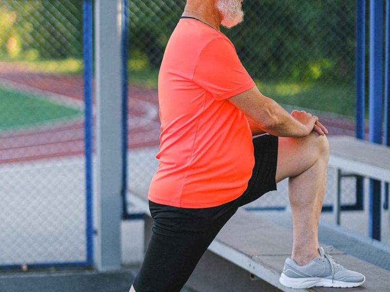 Man concentrating before a workout session, side profile view in a calm environment.