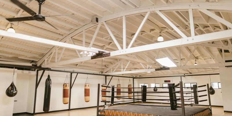 Wide shot of an empty, clean training area ready for a workout session.